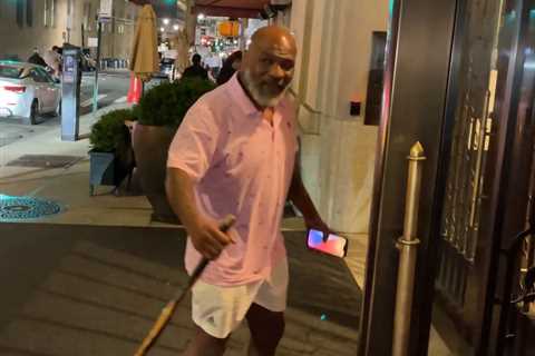 Fearsome Mike Tyson, 56, pictured using a walking stick as ex-heavyweight champion arrives at New..