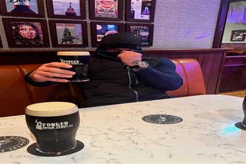 ‘F*** all yous’ – Conor McGregor covers up face while drinking pint after being mocked by fans for..