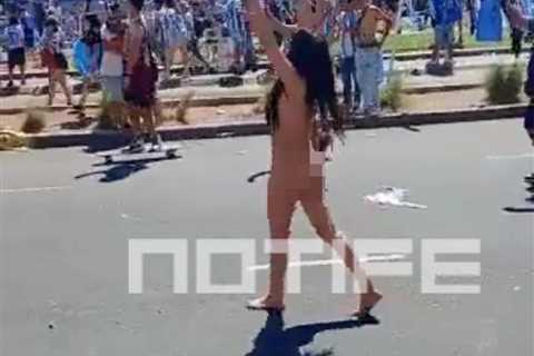 Watch as mystery brunette STRIPS NAKED to celebrate Argentina World Cup triumph in raucous Buenos..