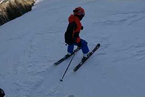 Max and Roma skiing in Aspen, CO